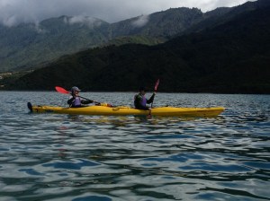 Paddling across with the storm coming over the mountains